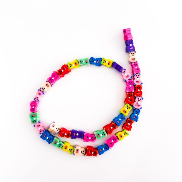 70010-16 - Tira de pucca/fimo ositos de colores