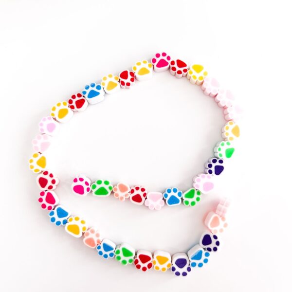70010-20 - Tira de pucca/fimo huella perro colores