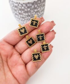 20126 - Dije miyuki negro con dorado