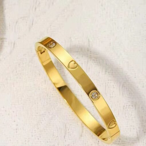 41062 - pulsera acero corazones con cristales dorado