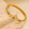 41069 - pulsera acero dorada con ojos turcos
