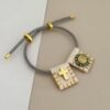 41086 - Pulsera tejida doble dije gris