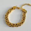 41096 - Pulsera acero gruesa uniones dorada