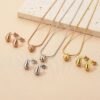 21091 - Set Dorado Zarcillos y collar tipo gota