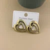 80059 - Zarcillos Corazon entre lineas acero