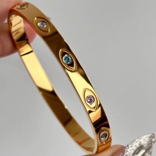 41118 - Pulsera dorada acero ojos turcos incrustados