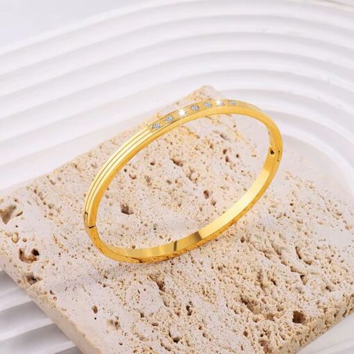 41140 - Pulsera acero dorada con tira de cristales