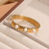 41058 - Pulsera Dorada Acero con perlas