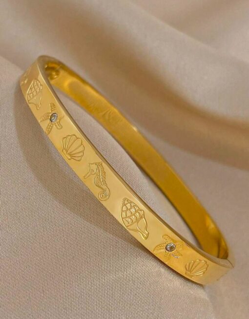 41084 - Pulsera Acero dorada multifigura