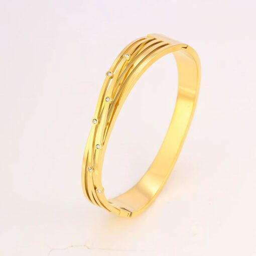 41015 - Pulsera acero dorada multi linea