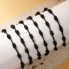 41081-1 Pulsera 7 nudos negro