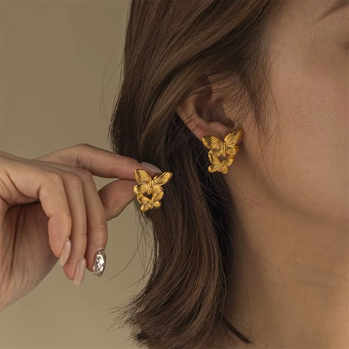 80028 - Zarcillo mariposa Acero dorado