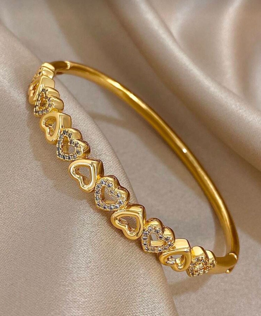 41089 - Pulsera acero dorada multi corazones