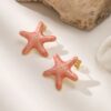 80110-6 Zarcillos acero esmaltado estrella salmon
